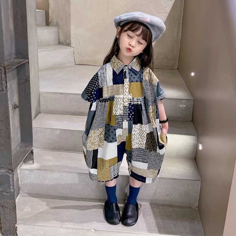 Childrens vacation beach overalls girls Korean summer jumpsuit fashionable and sweet lapel patchwork loose jumpsuit W240806