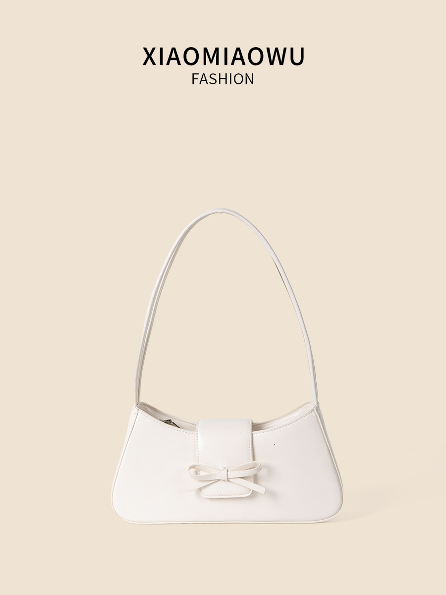 Spring and summer new women's high-end fashion commuting handbag bow spicy girl niche silver armpit bag