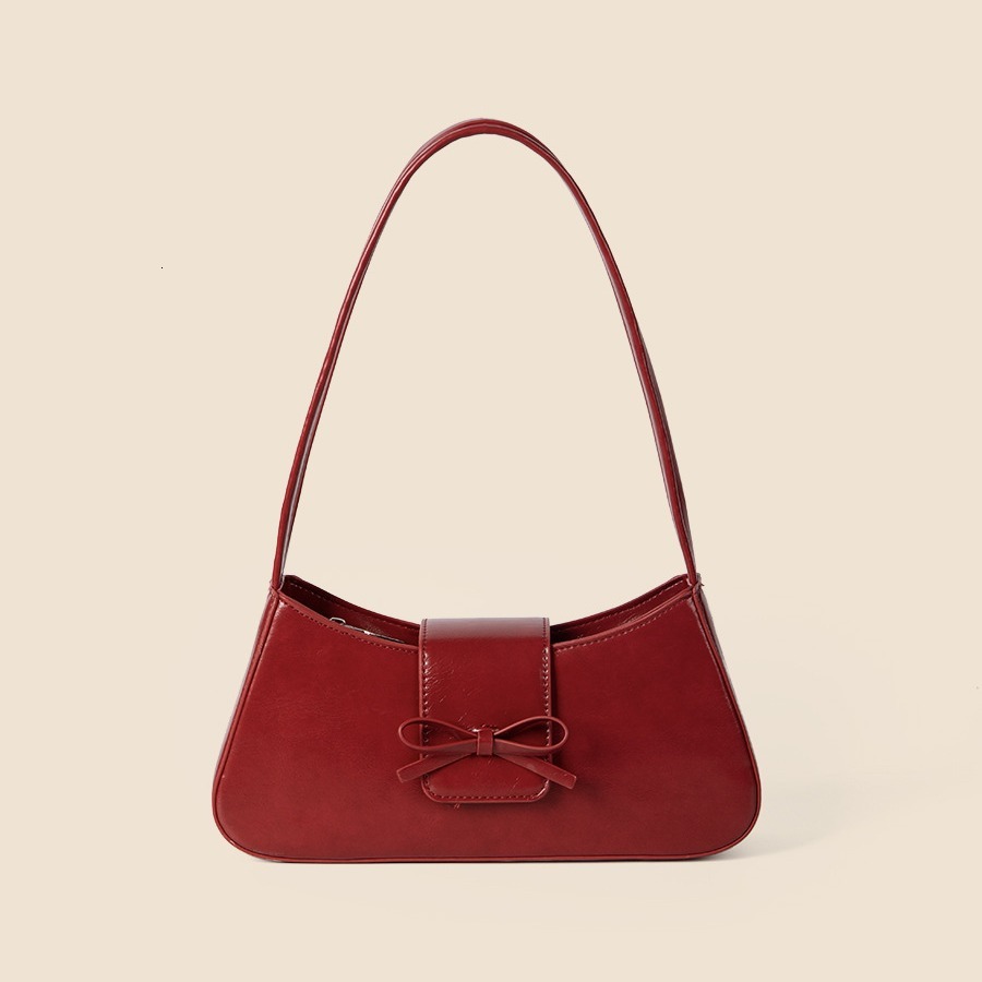 Spring and summer new women's high-end fashion commuting handbag bow spicy girl niche silver armpit bag
