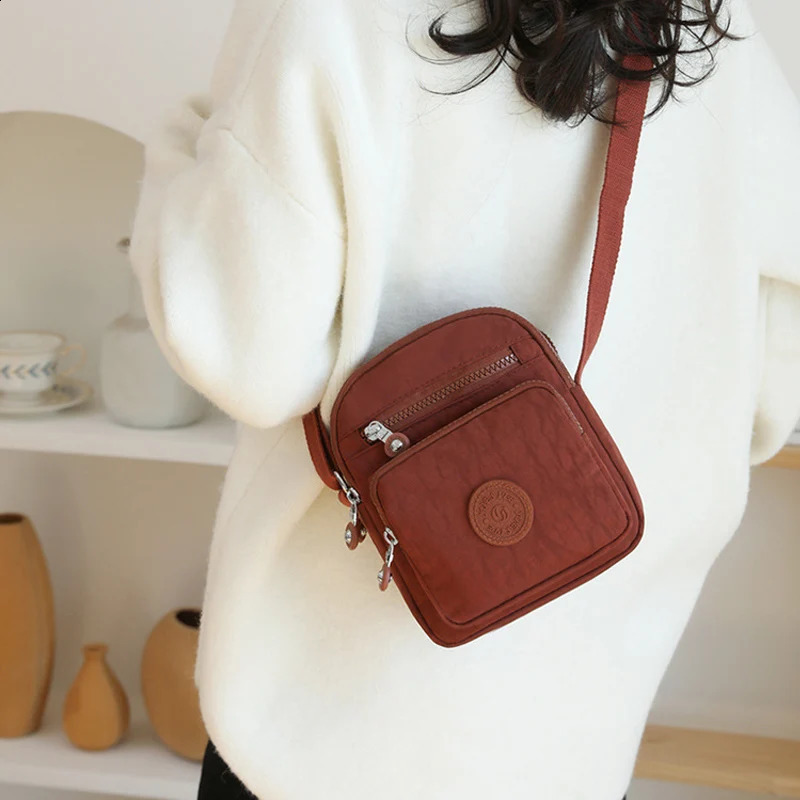 Womens Mini Shoulder Bag 2024 Waterproof Nylon Stand up Mobile Wallet Multi layer Messenger Bag Womens Mini Cross Bag 240819