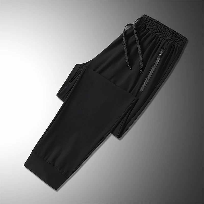 Summer ice silk mens breathable quick drying casual slim pants jogging mens black zipper pocket sports fitness pantsW240725