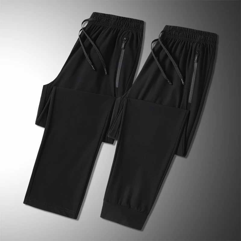 Summer ice silk mens breathable quick drying casual slim pants jogging mens black zipper pocket sports fitness pantsW240725