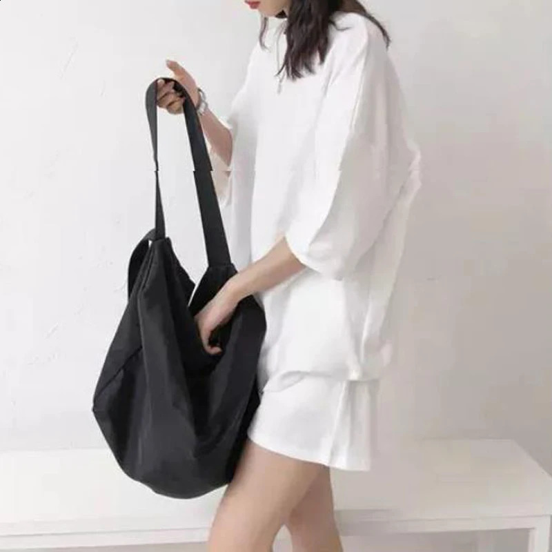 Womens twopiece set summer trend simple casual street wear short sleeved Tshirt womens solid loose pocket beach shorts 240821