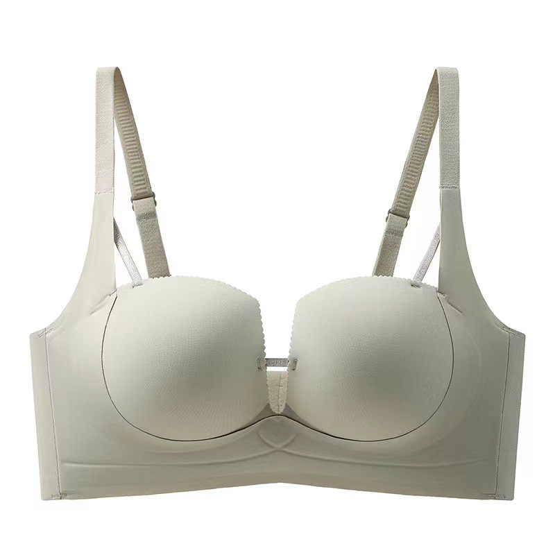 Untouched lingerie for women, with pull tab that gathers small breasts, showing off a large reduction. The accessory breasts are sagging, anti outward