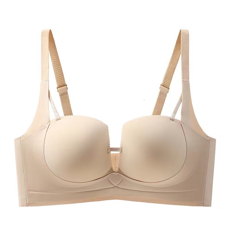 Untouched lingerie for women, with pull tab that gathers small breasts, showing off a large reduction. The accessory breasts are sagging, anti outward