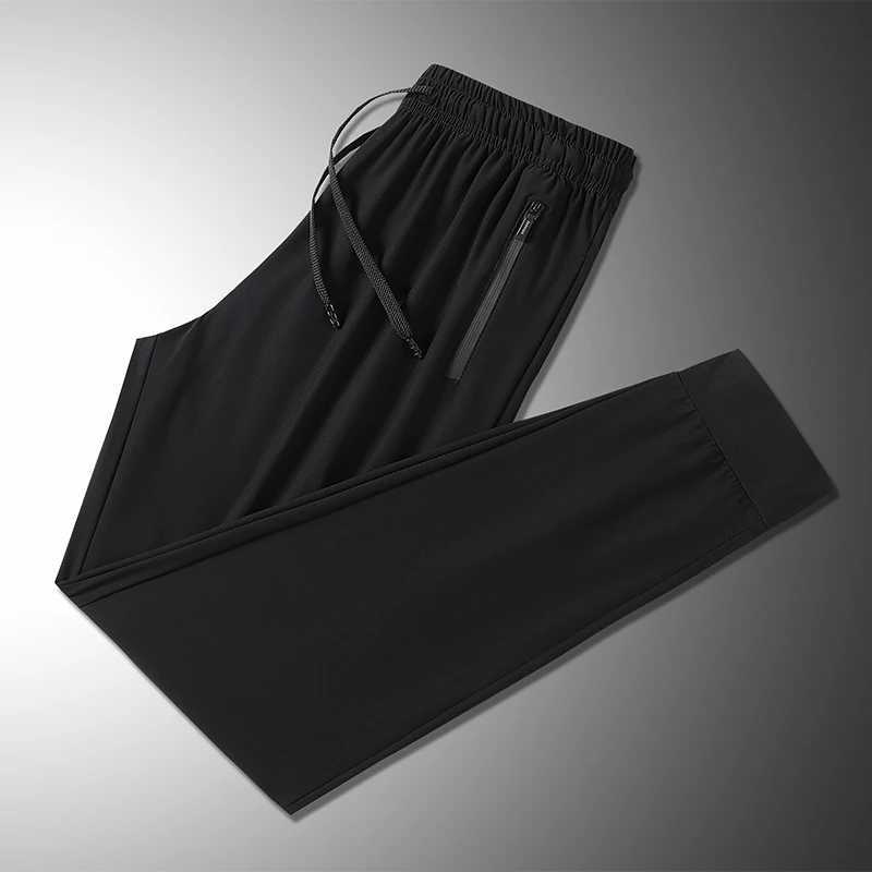 Summer ice silk mens breathable quick drying casual slim pants jogging mens black zipper pocket sports fitness pantsW240725