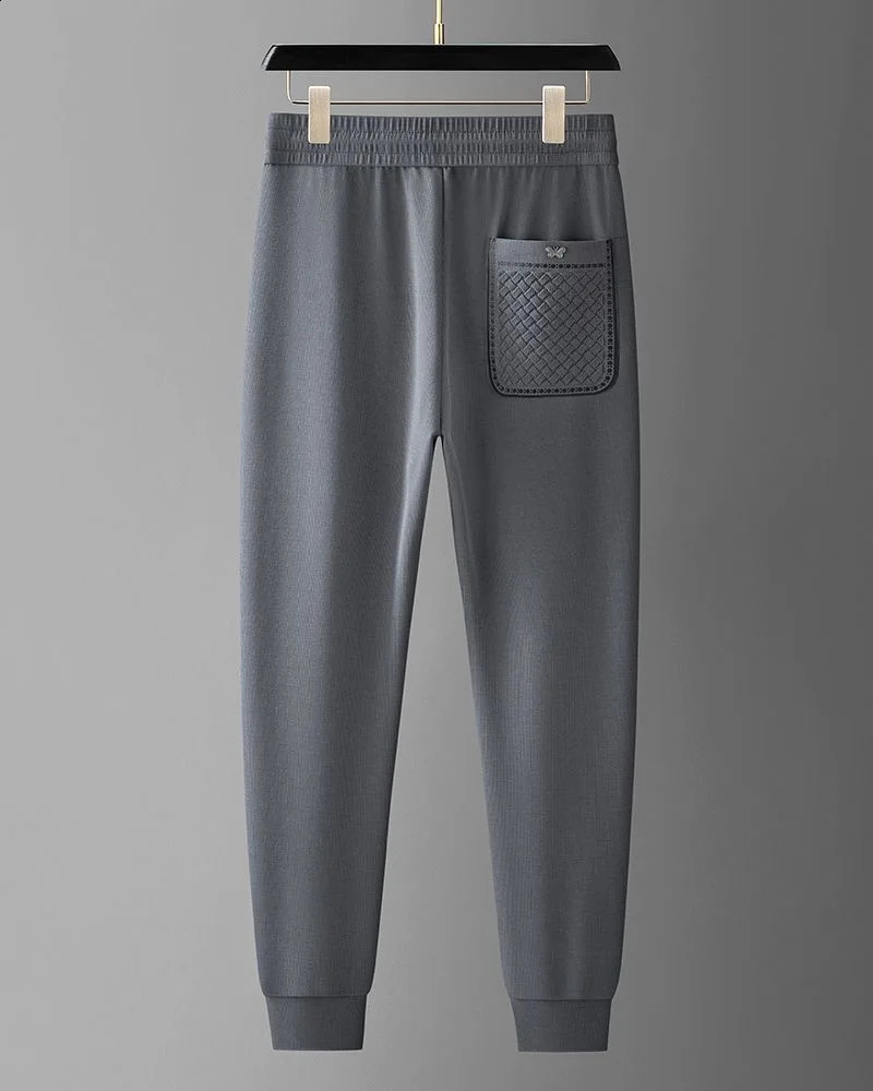 Comfortable and soft molded ice silk casual pants for spring summer suitable mens small leg knitted vertical striped sports 240821