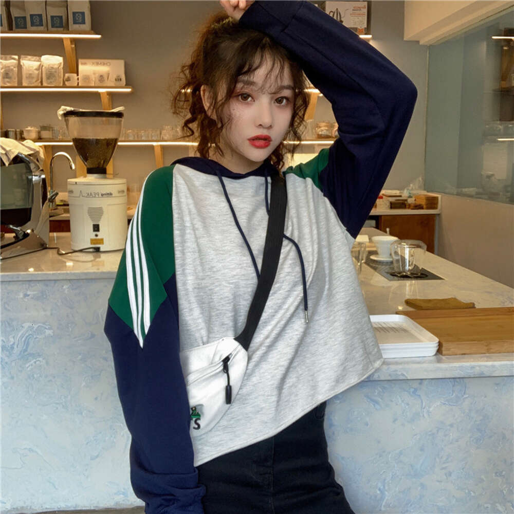 College style color blocked loose striped long sleeved sweatshirt for women in autumn , thin sports pullover hooded casual jacket dongdumaoyi
