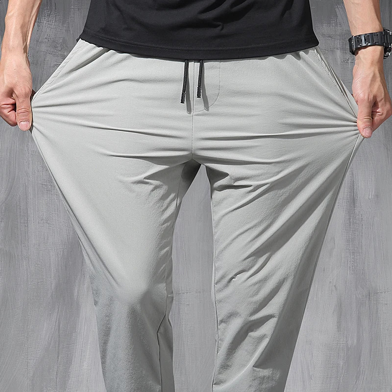 Korean Ice Silk Elastic Trousers Four Seasons Thin Casual MenS Loose 9-Point Large Size Small Foot Sports Pants Spring 240822