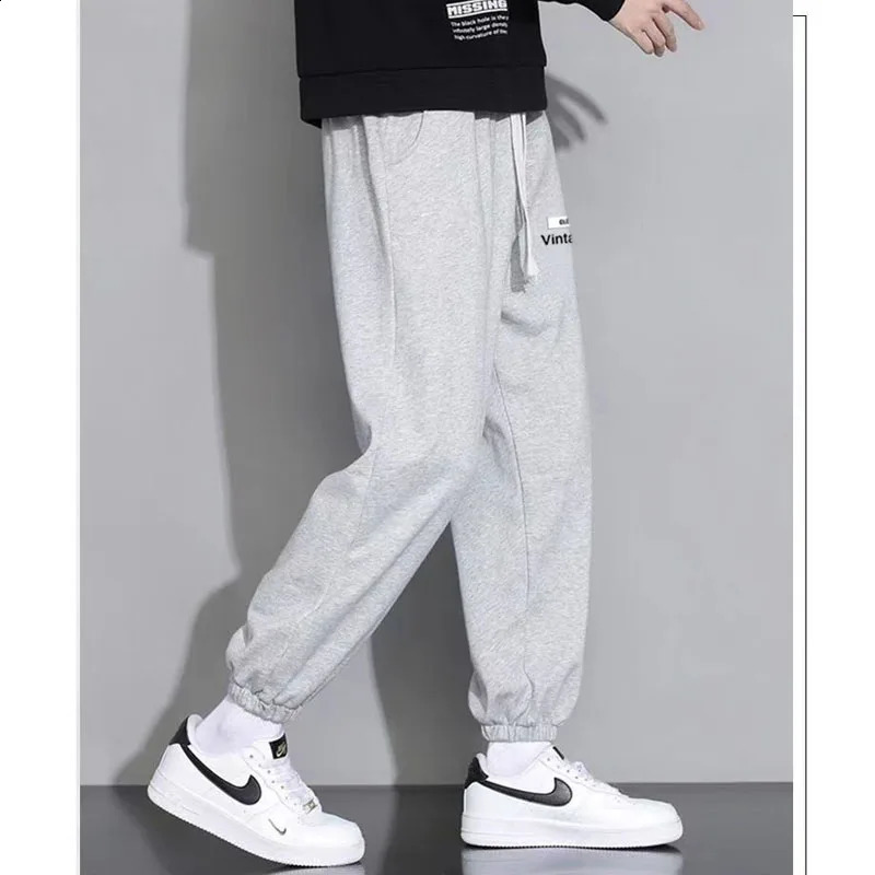 Spring and Autumn Fashion Casual Versatile Oversized Solid Color Tied Feet 9/4 Trendy Loose and Elegant Men Sports Pants 240822