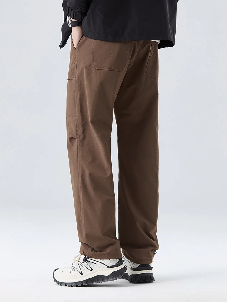 Spring and autumn mens cargo pants outdoor waterproof elastic nylon straight adjustable hem loose fit for runners 240823