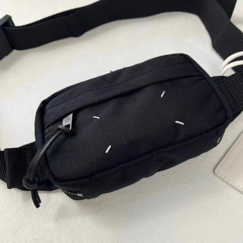 Unique and trendy black nylon crossbody bag for both men and women featuring a niche original and fashionable waist bag 250318