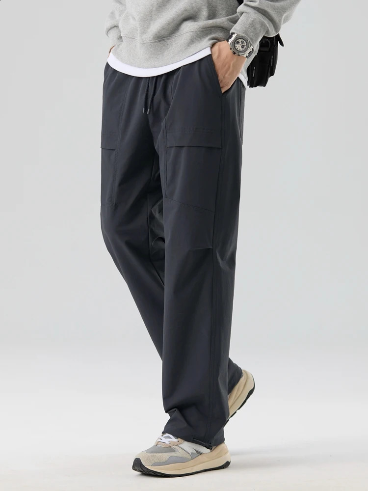 Spring and autumn mens cargo pants outdoor waterproof elastic nylon straight adjustable hem loose fit for runners 240823