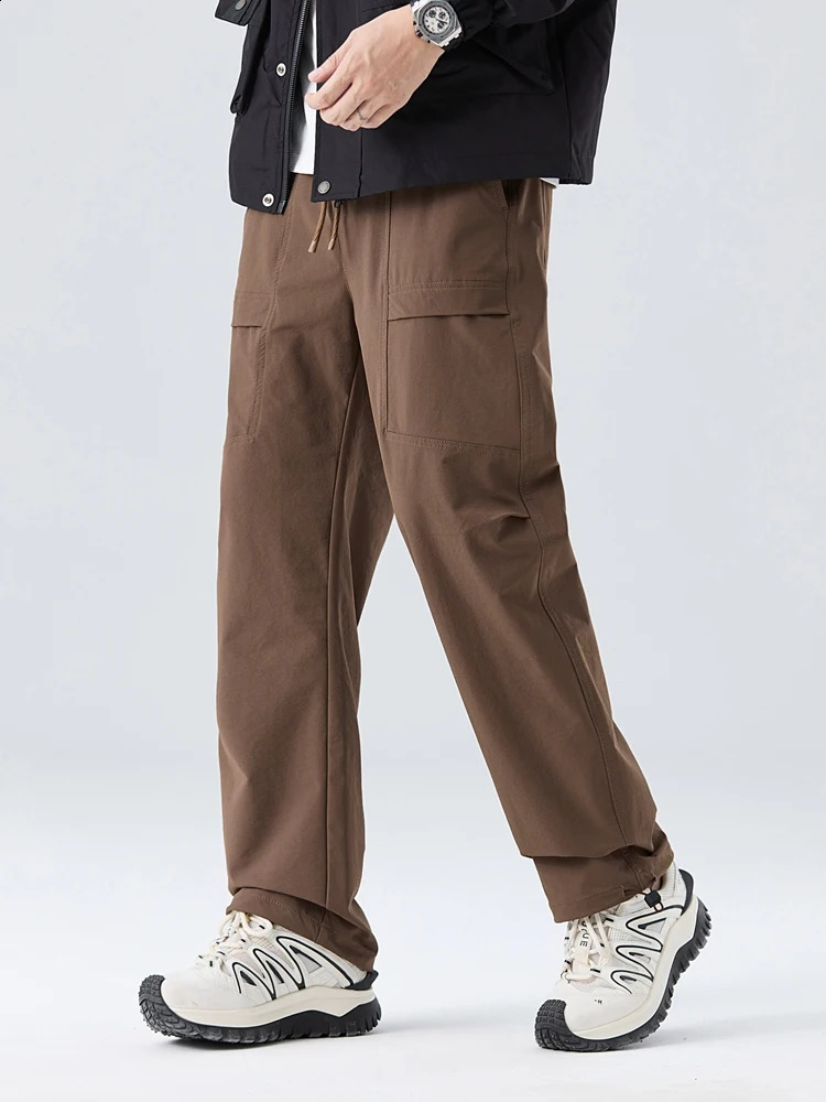 Spring and autumn mens cargo pants outdoor waterproof elastic nylon straight adjustable hem loose fit for runners 240823