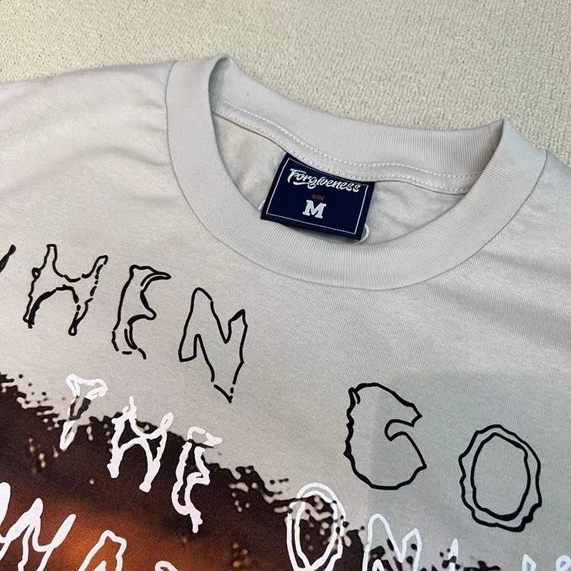 High Street sunset figures printed roundnecked apricot shortsleeved tshirt 240822