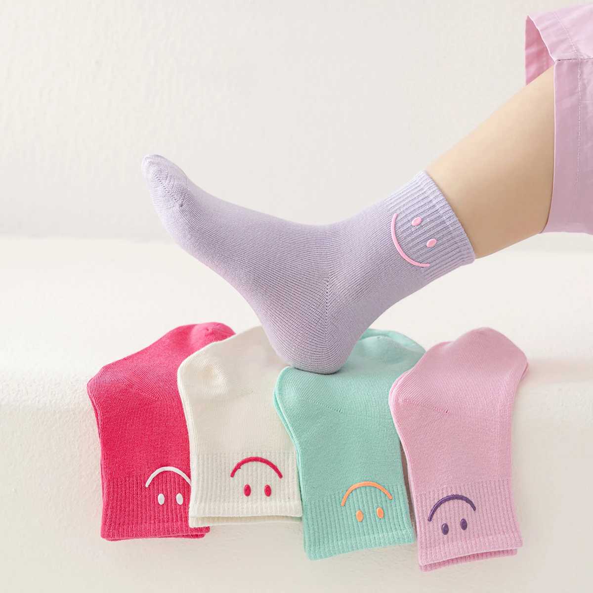 5 pairs of solid colored smiling face dopamine colored mid tube childrens round socks suitable for both men and women CL240824
