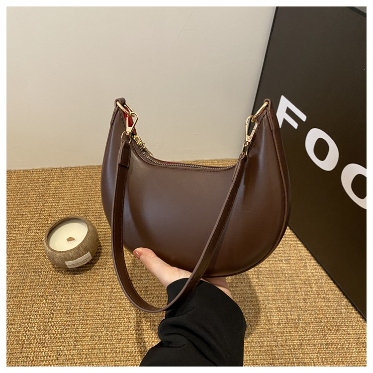 Solid color texture light luxury hand-held crescent retro shoulder bag