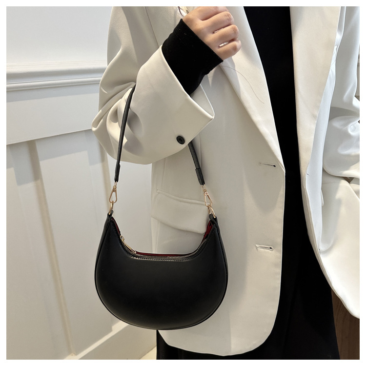 Solid color texture light luxury hand-held crescent retro shoulder bag