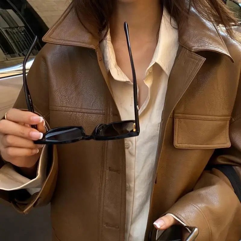 Artificial leather jacket womens long sleeved motorcycle jacket Korean fashion button cut top bomber jacket spring and autumn jacket 240827