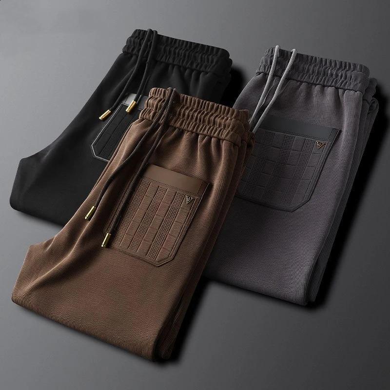 High end letter embossed embroidery casual mens pants spring and summer trend loose fit suitable for sports mens pants 240828