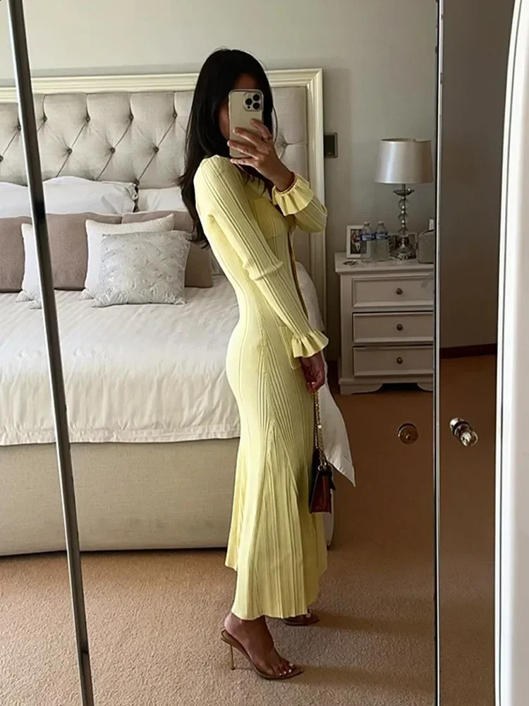 Knitted elegant yellow single breasted button up dress for women featuring a unique lapel and full sleeves with ruffled hem long skirt for womens offi