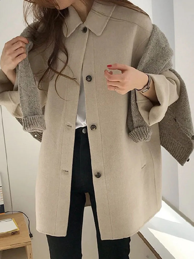 Artificial wool coat womens autumn and winter long sleeved lapel mid length jacket womens Korean fashion preparatory shoulder strap jacket 240828