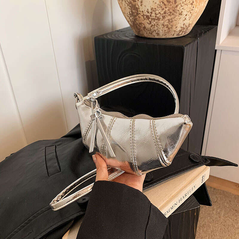 Niche design, high-end mini cowhorn bag in 2024, new exquisite hand-held strap, zero wallet for women