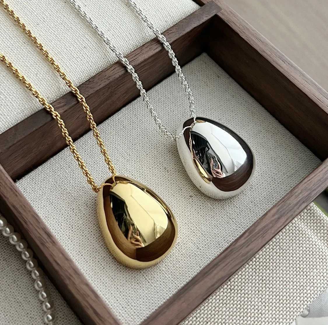 Smooth oval shaped droplet pendant necklace made of metal suitable for women girls stainless steel long coats necklaces and charming jewelry gifts W24