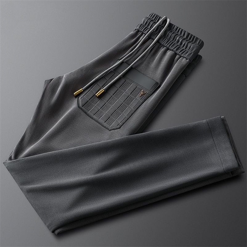 High end letter embossed embroidery casual mens pants spring and summer trend loose fit suitable for sports mens pants 240828
