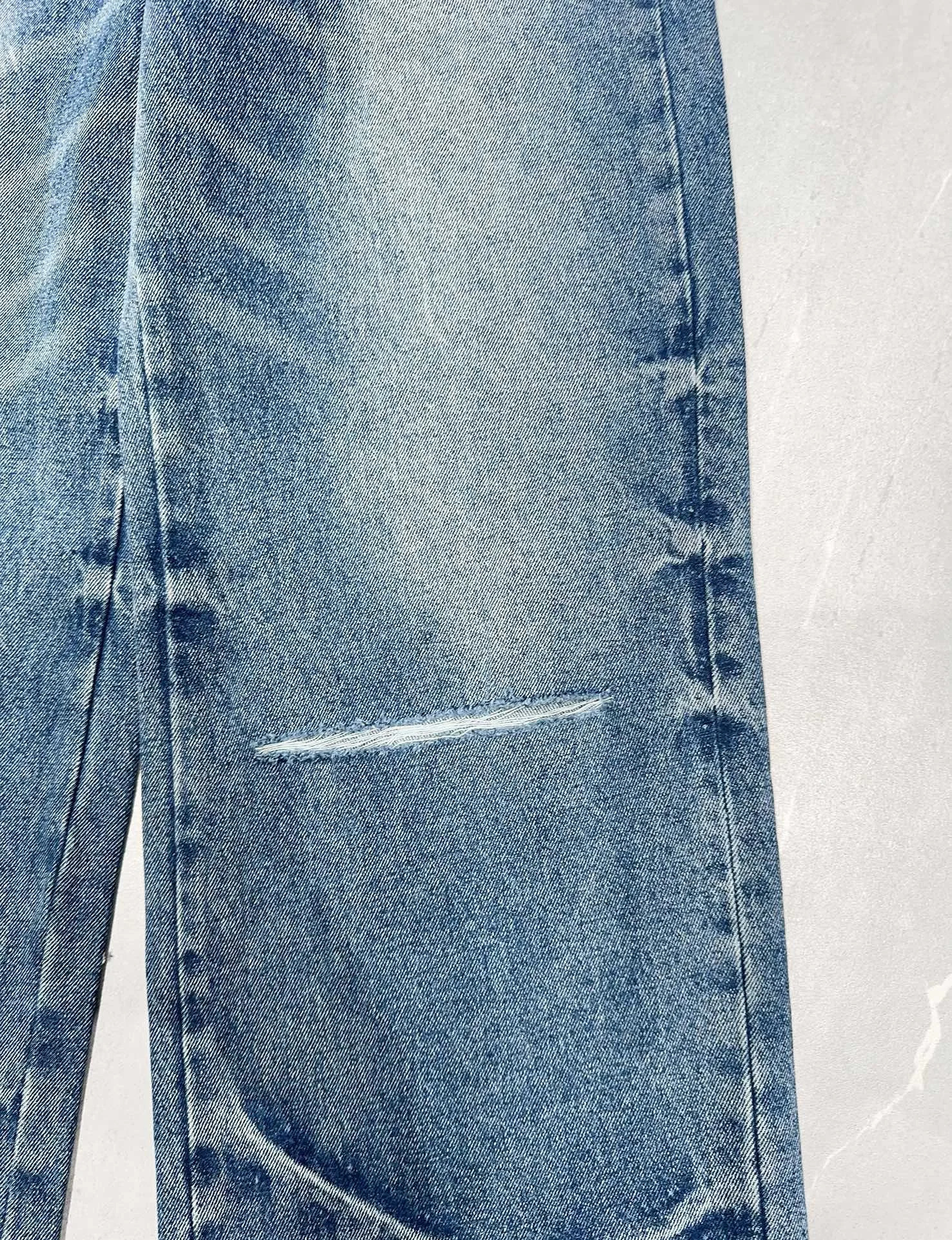 The latest blue wide leg mens tight jeans suitable for pocket denim pants with letter embroidery and tear holes on the knees 240829
