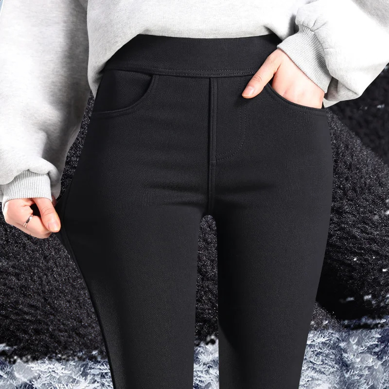Womens long legs wearing high waisted tight black in winter with extra lined pencils tapered autumn and wool pads 240827