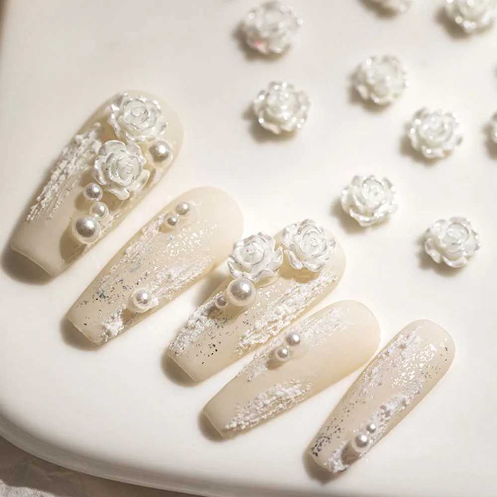 A box of 3D floral nail art decoration tea flower rhinestone crystal nail charm parts for DIY nail accessories in France W240829