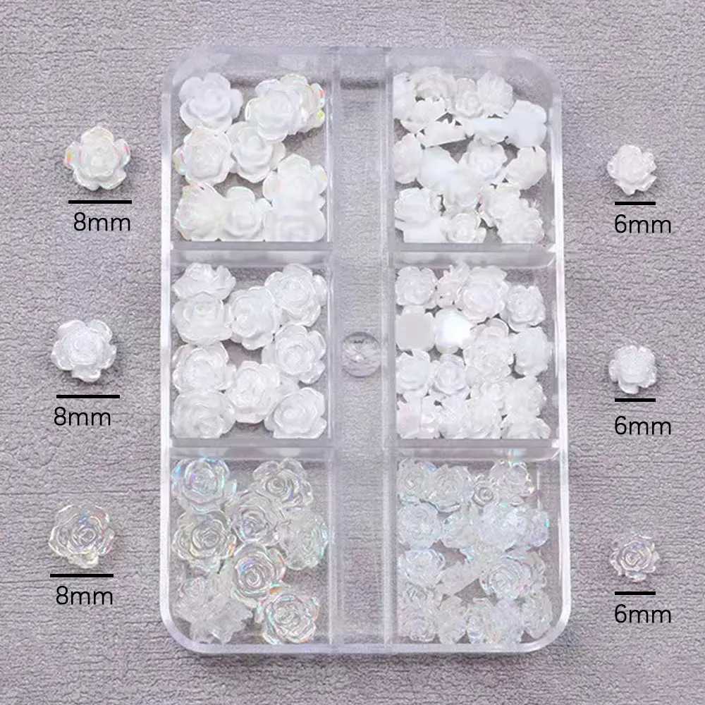 A box of 3D floral nail art decoration tea flower rhinestone crystal nail charm parts for DIY nail accessories in France W240829