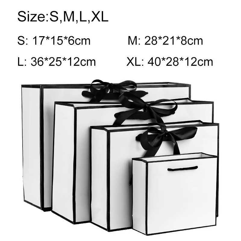 Luxury gift packaging with white cardboard box black border shopping bag portable handbag bow tie party suppliesX240831