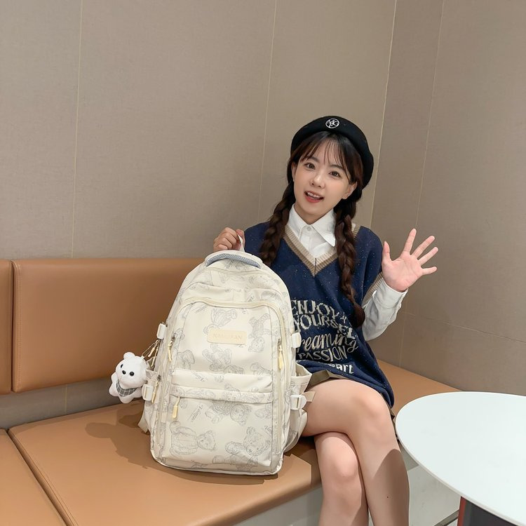 2025S designer Schoolbag female junior high school students simple and versatile printing bear niche design new college student computer backpack tren