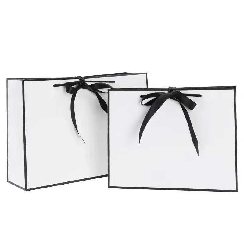 Luxury gift packaging with white cardboard box black border shopping bag portable handbag bow tie party suppliesX240831