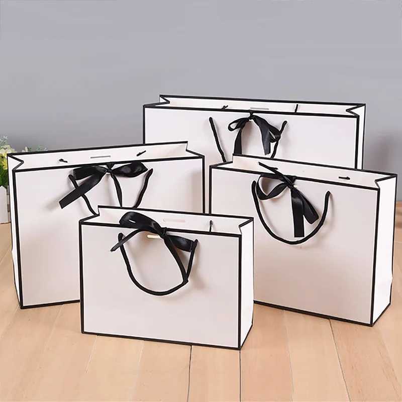 Luxury gift packaging with white cardboard box black border shopping bag portable handbag bow tie party suppliesX240831
