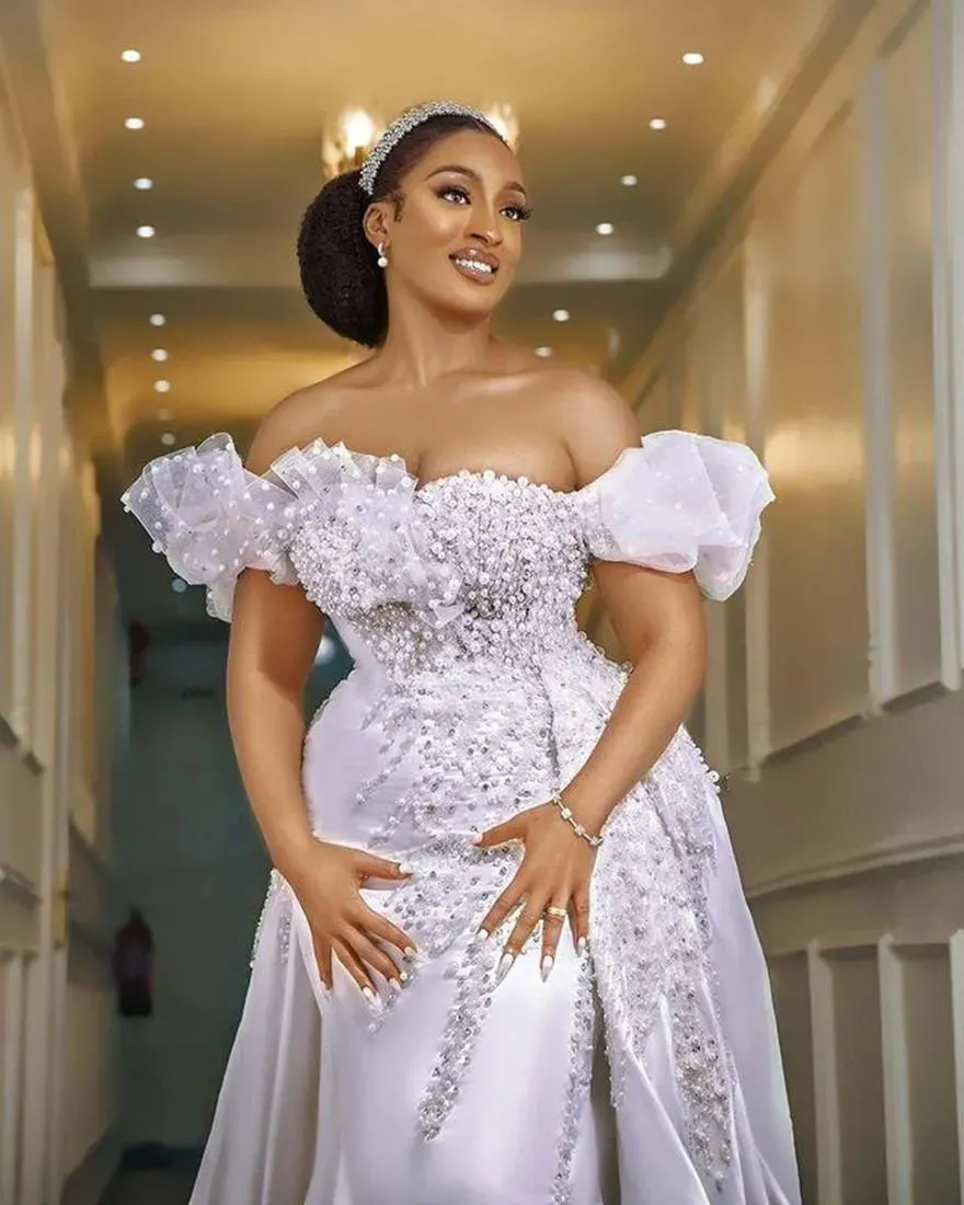 Luxury White Mermaid Wedding Dresses Pearls Beaded Off Shoulder Long Satin Bridal Gowns With Detachable Skirt Ruffles Ruched Modern Chic Arabic Africa