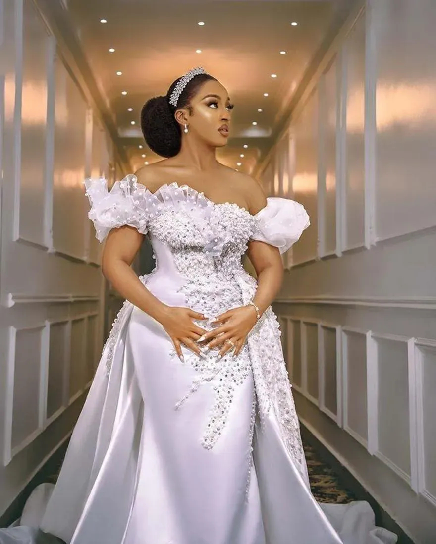 Luxury White Mermaid Wedding Dresses Pearls Beaded Off Shoulder Long Satin Bridal Gowns With Detachable Skirt Ruffles Ruched Modern Chic Arabic Africa