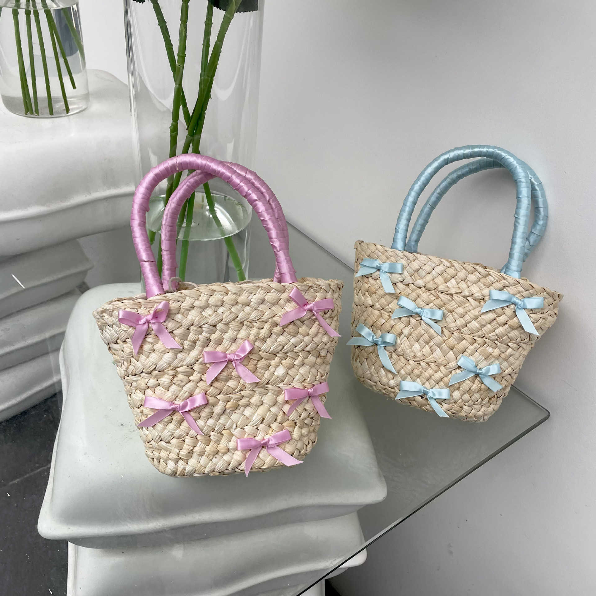Japanese and Korean Bowtie Lafite Grass Woven Bag 2024 Spring Summer New Beach Vacation Handbag Water Bucket 240312