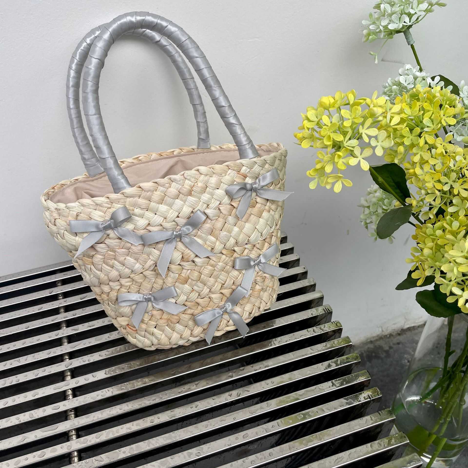 Japanese and Korean Bowtie Lafite Grass Woven Bag 2024 Spring Summer New Beach Vacation Handbag Water Bucket 240312