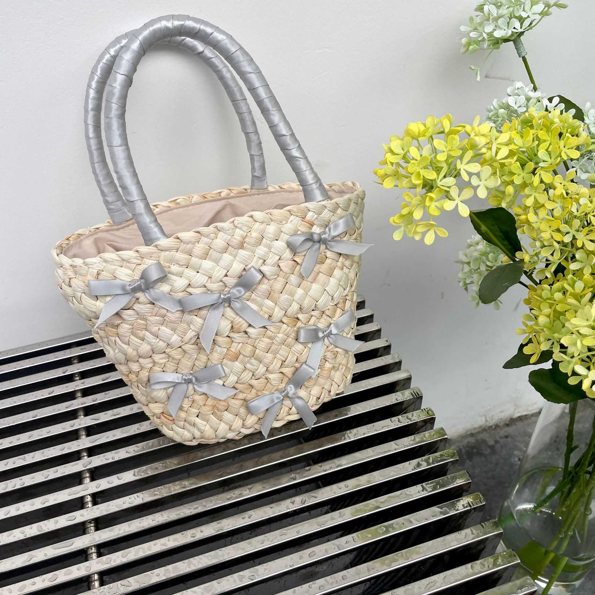 Japanese and Korean Bowtie Lafite Grass Woven Bag 2024 Spring Summer New Beach Vacation Handbag Water Bucket 240312