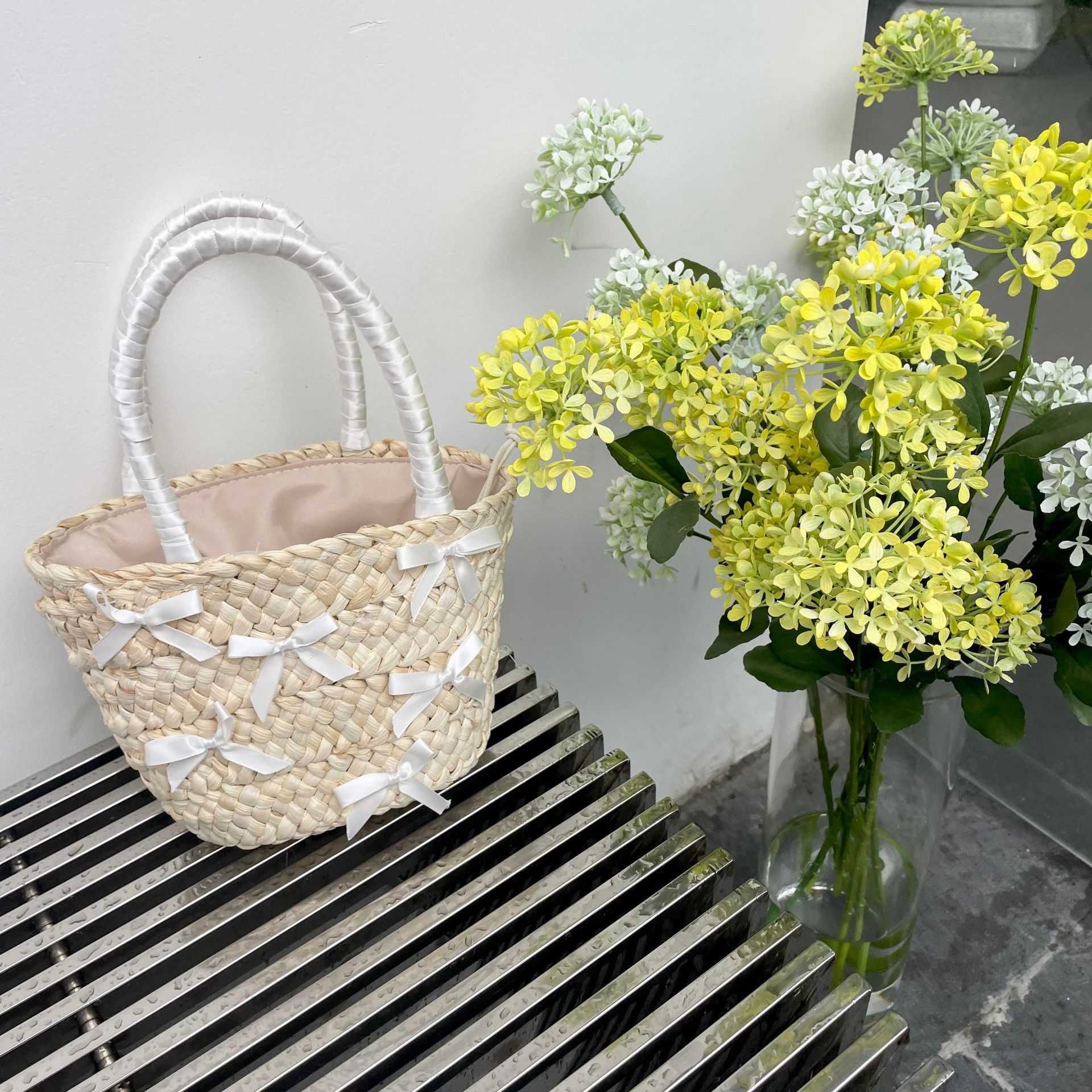 Japanese and Korean Bowtie Lafite Grass Woven Bag 2024 Spring Summer New Beach Vacation Handbag Water Bucket 240312