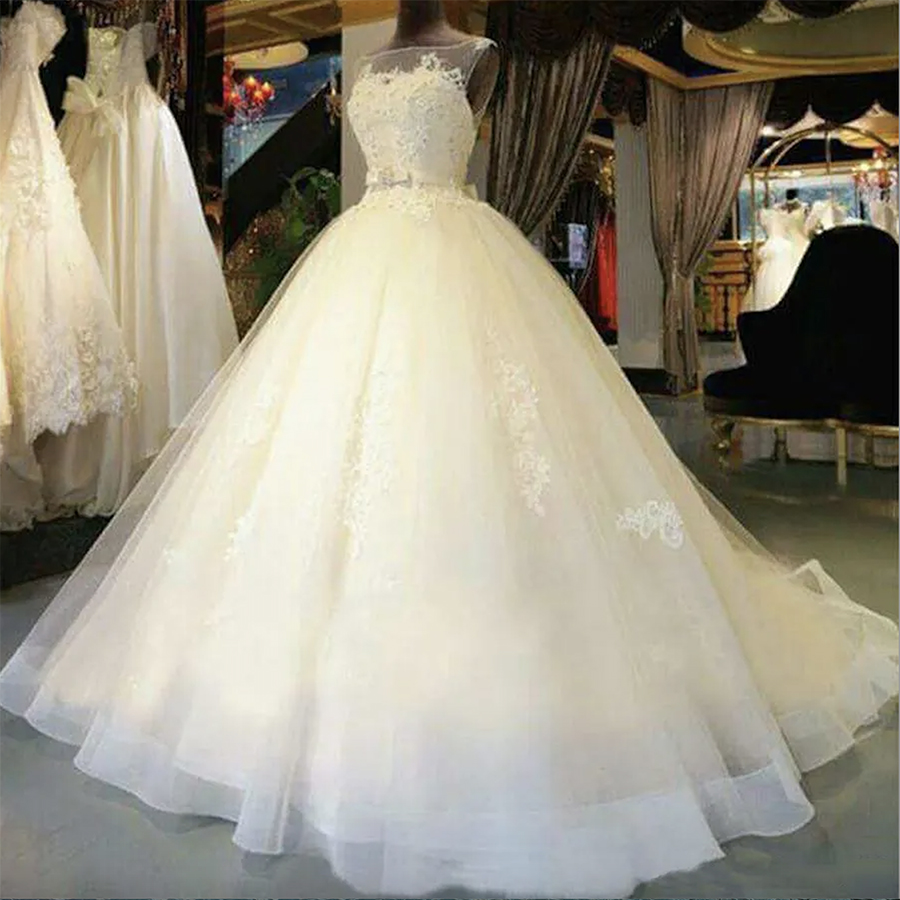 2024 Beautiful Ball Gown Sleeveless Tulle Wedding Dresses Illusion Necke Appliques Elegnat Bridal Gowns Custom Made Court Train