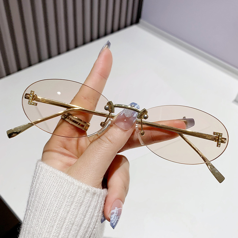 Dia-encrusted Rimless cut edge Oval Cat Eye Sunglasses for Women Fashion high-end Small Frame Trend Sun Glasses Designer Eyewear Free shipping