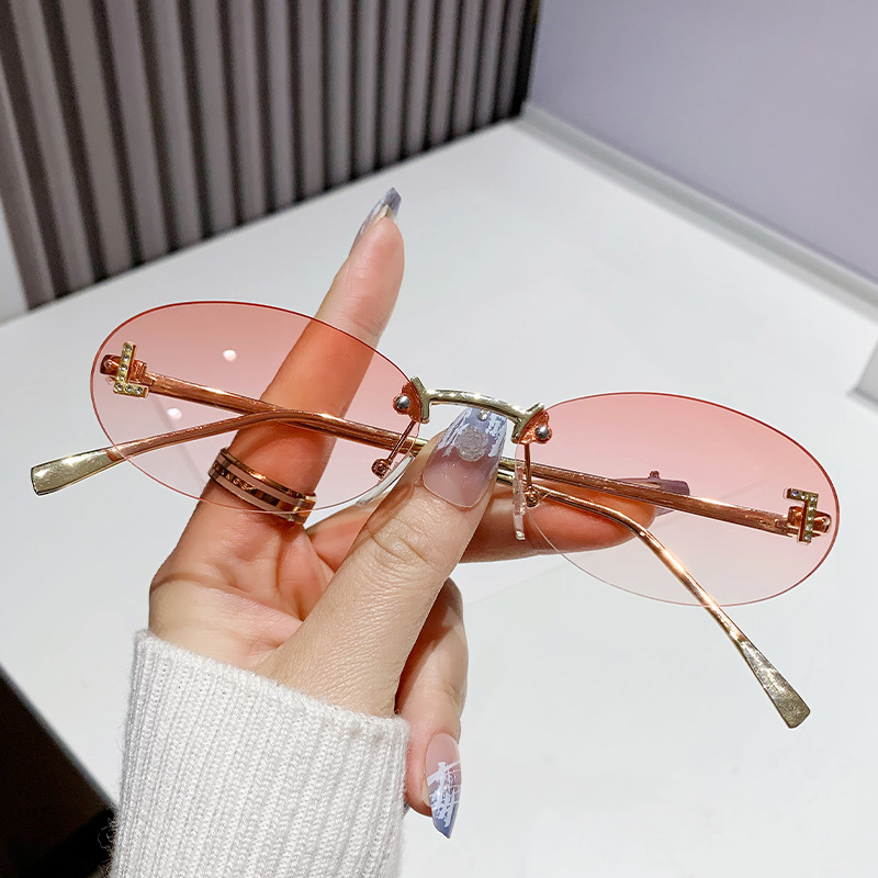 Dia-encrusted Rimless cut edge Oval Cat Eye Sunglasses for Women Fashion high-end Small Frame Trend Sun Glasses Designer Eyewear Free shipping