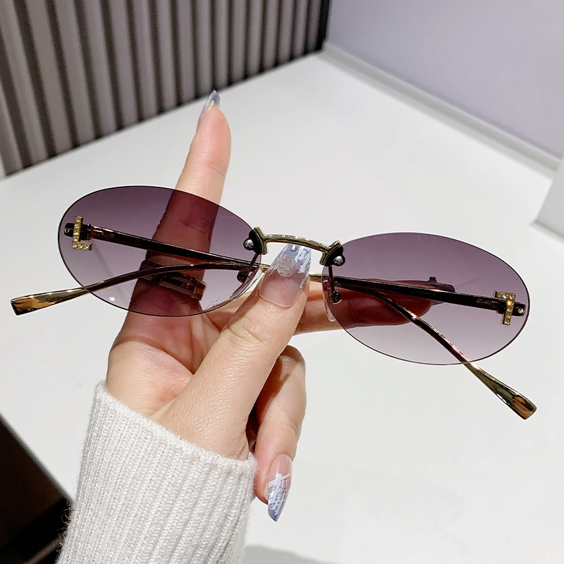 Dia-encrusted Rimless cut edge Oval Cat Eye Sunglasses for Women Fashion high-end Small Frame Trend Sun Glasses Designer Eyewear Free shipping