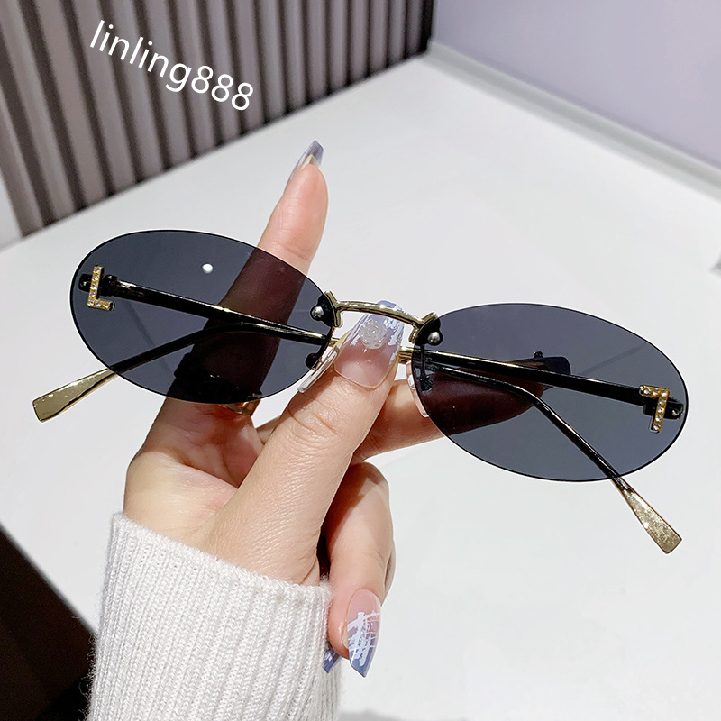 Dia-encrusted Rimless cut edge Oval Cat Eye Sunglasses for Women Fashion high-end Small Frame Trend Sun Glasses Designer Eyewear Free shipping