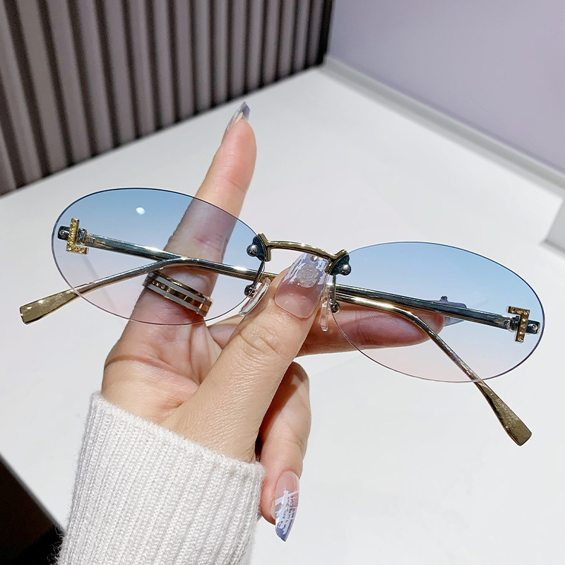 Dia-encrusted Rimless cut edge Oval Cat Eye Sunglasses for Women Fashion high-end Small Frame Trend Sun Glasses Designer Eyewear Free shipping