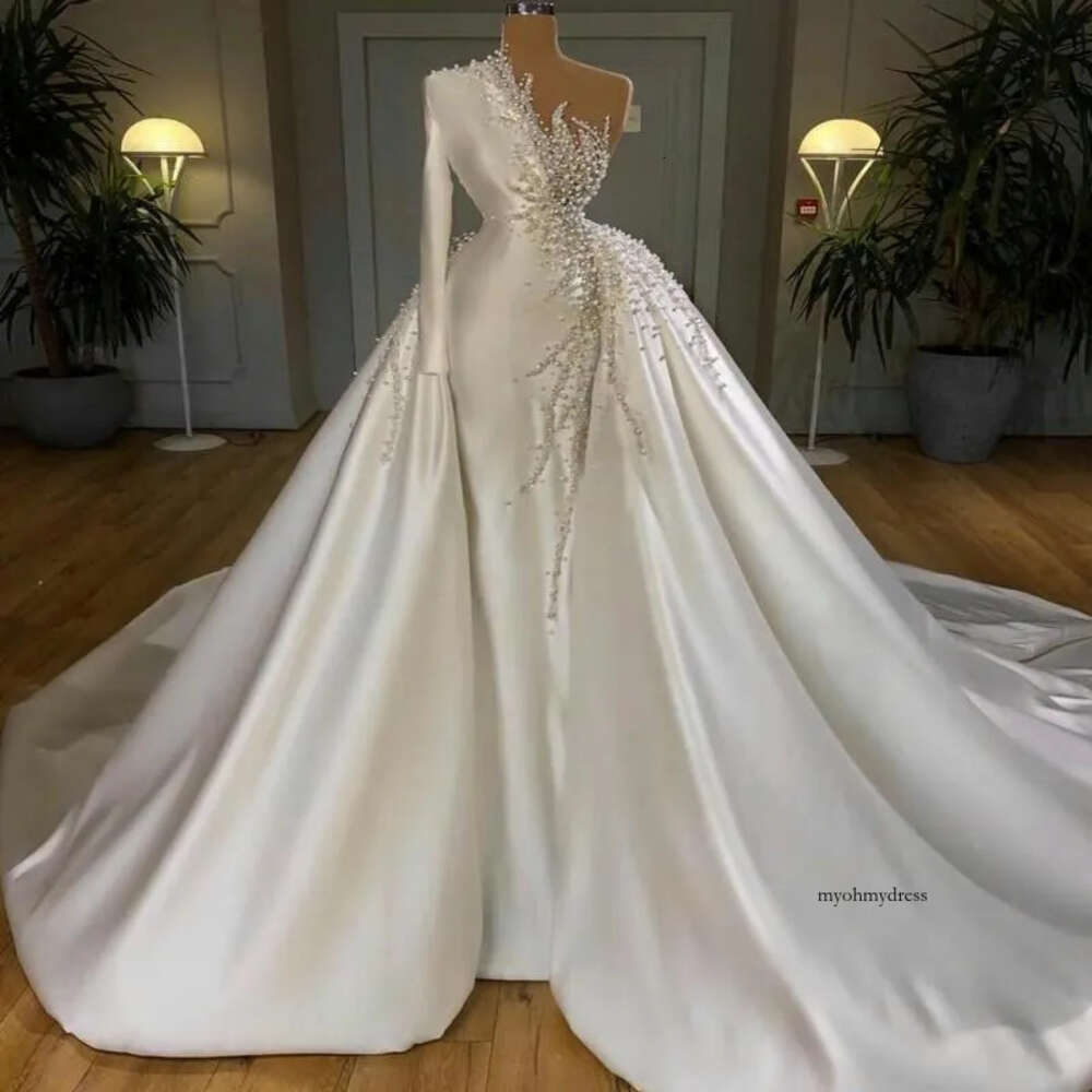 2024 Mermaid Wedding Dresses Pearls Crystal Beadings One Shoulder Satin Long Sleeves Overskirts Detachable Train Plus Size Bridal Gowns 0513